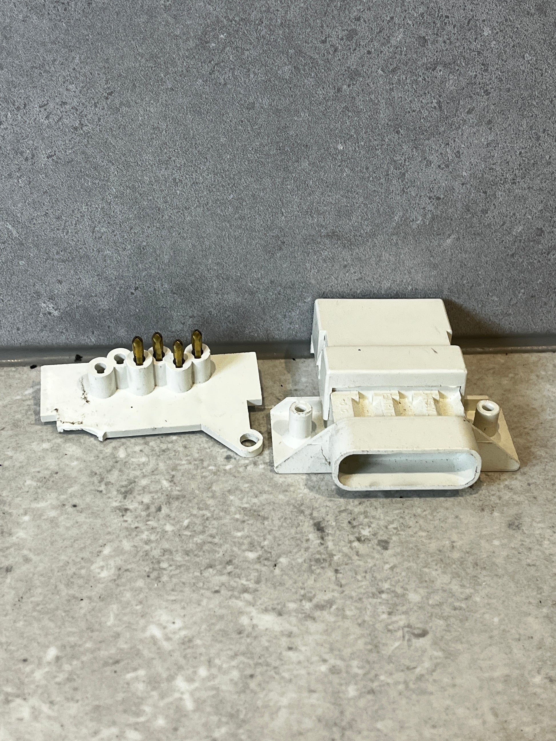 White multi-pin electrical connector set shown assembled and separated