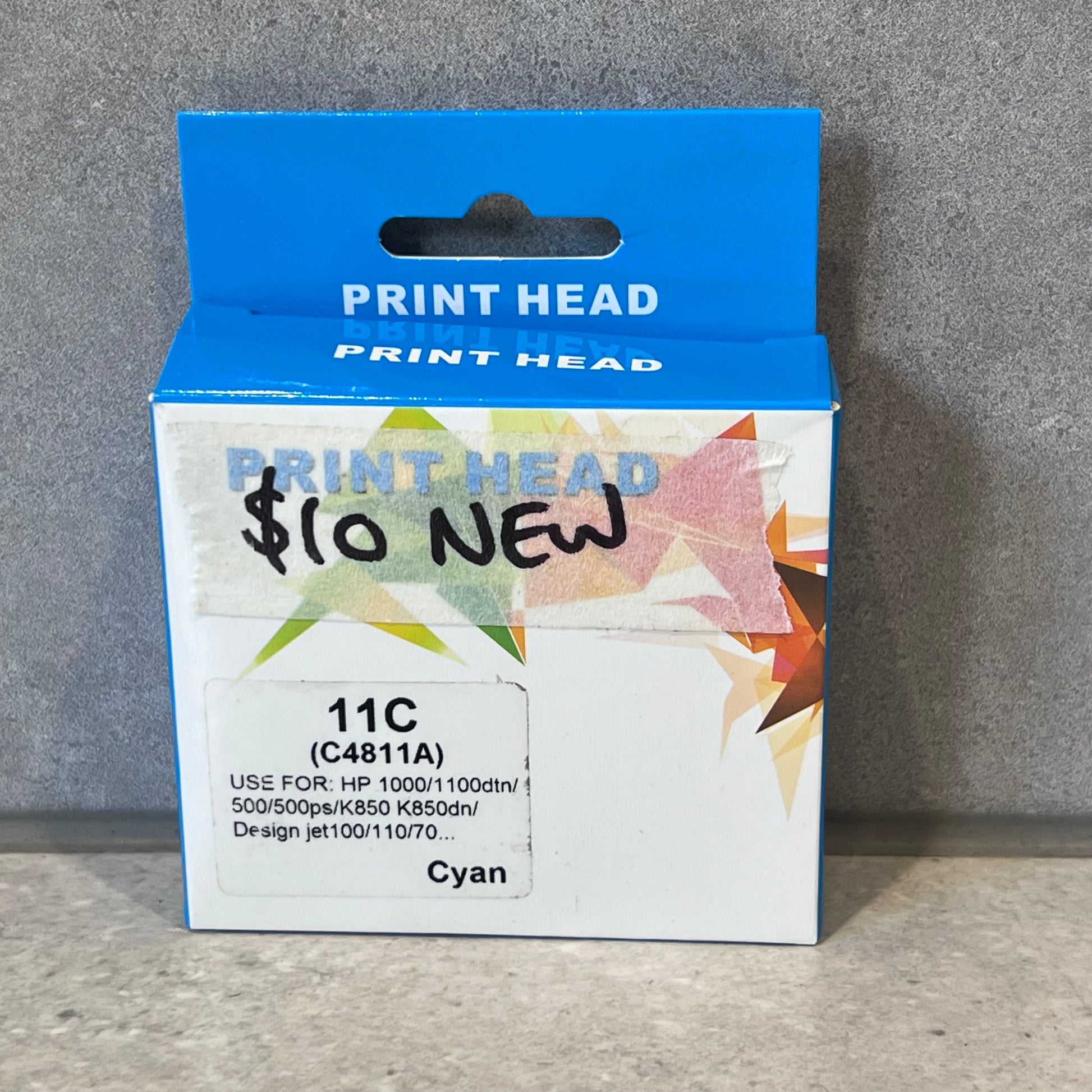 Front view of Print Head 11C Cyan packaging for HP printers