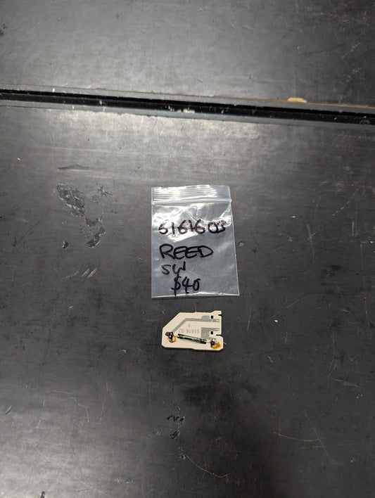 Reed Switch Sensor part 5161603 with labeled bag on a dark surface