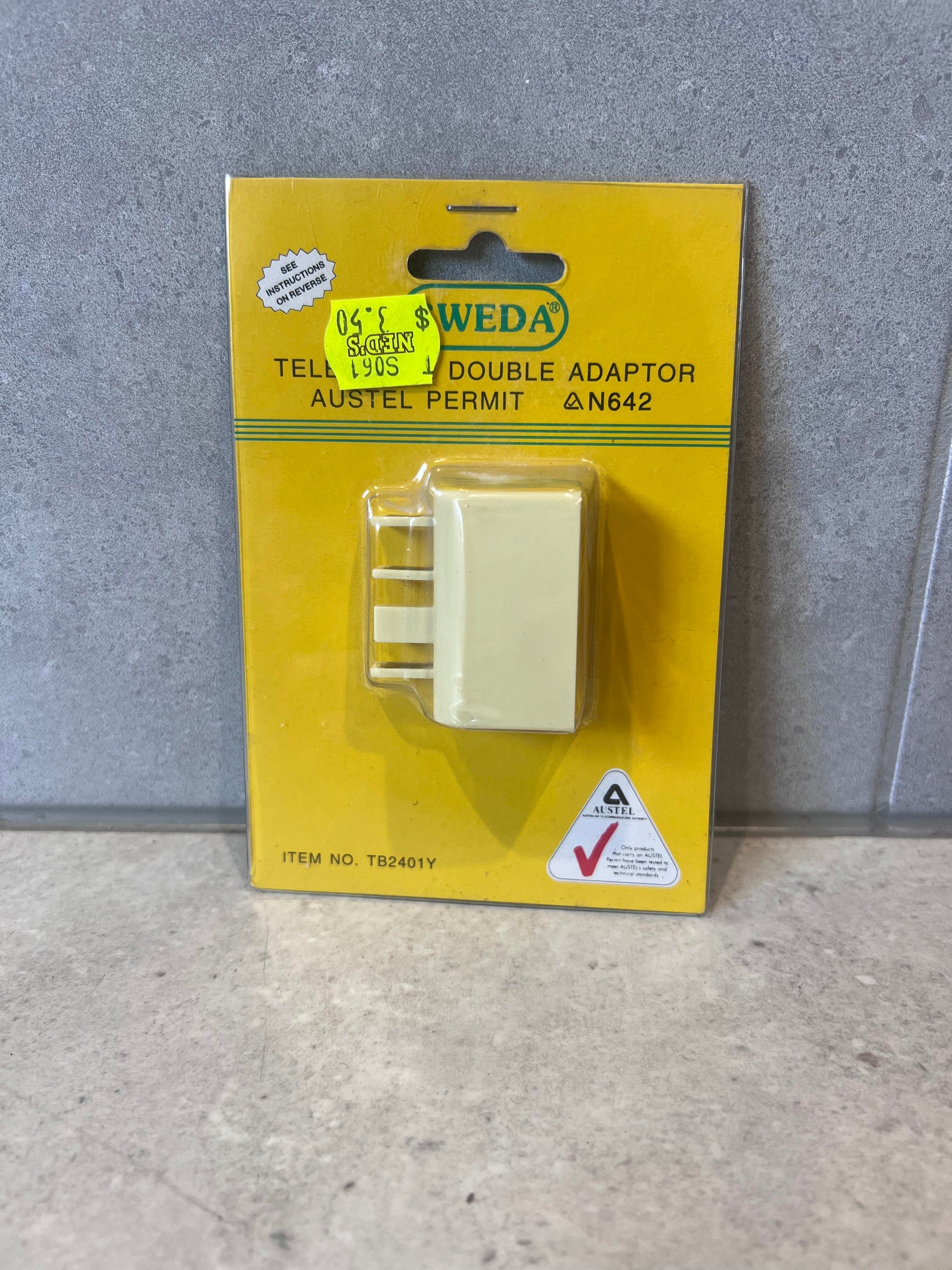 Front view of Sweda Telephone Double Adaptor in retail packaging