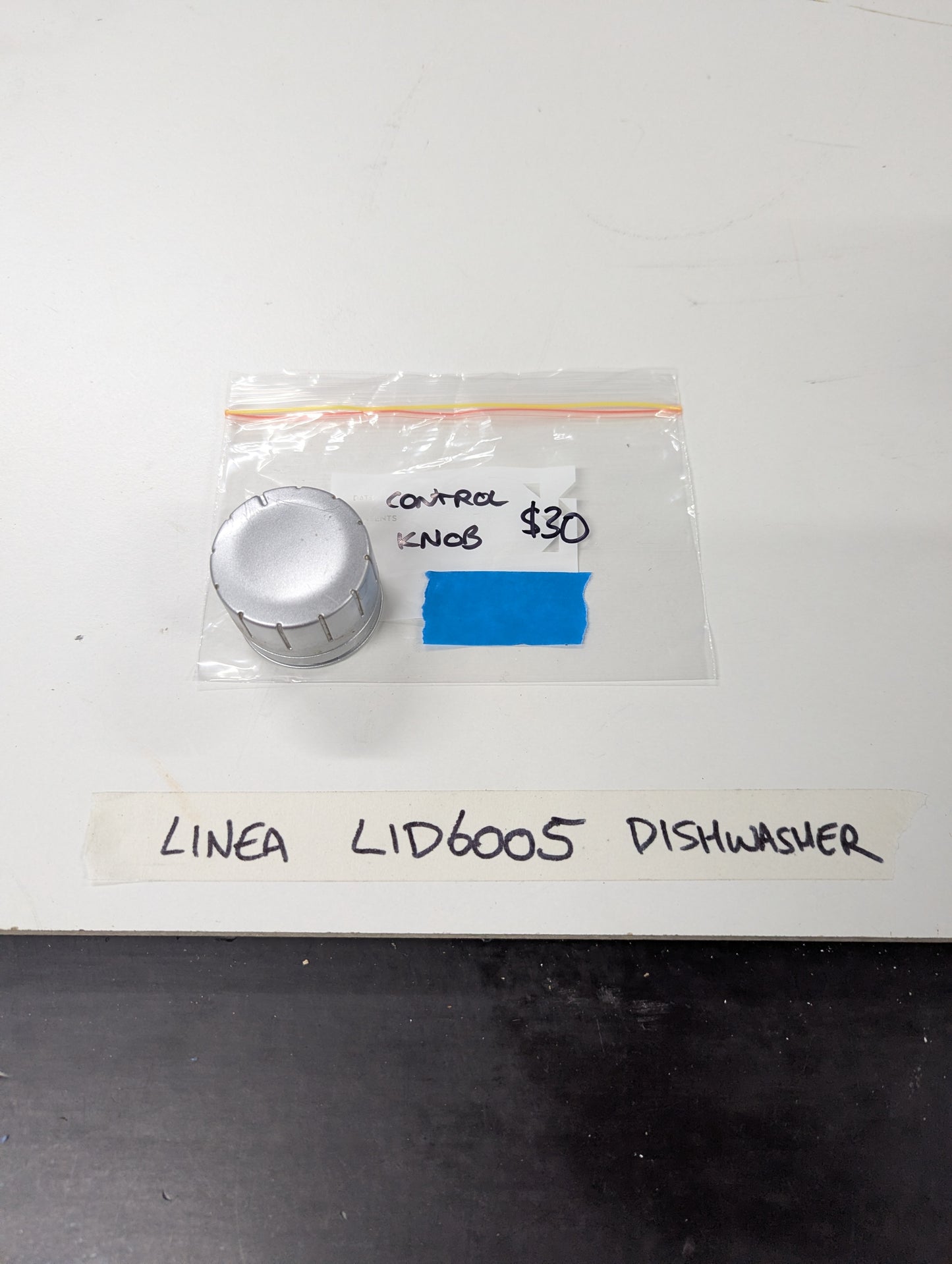 Silver control knob for Linea LID6005 dishwasher with label and price