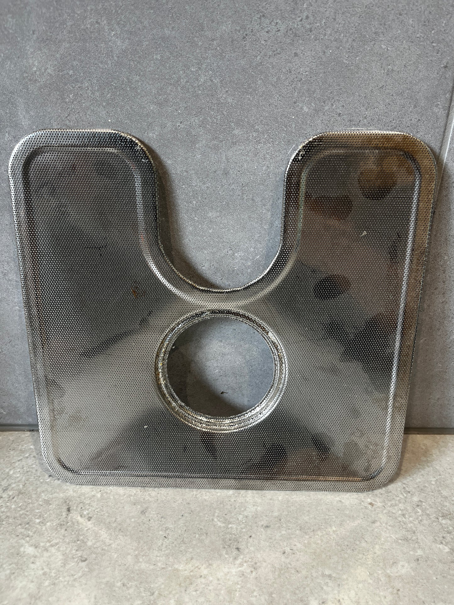 Stainless steel gas stove burner protector with central circular cutout and U-shaped design