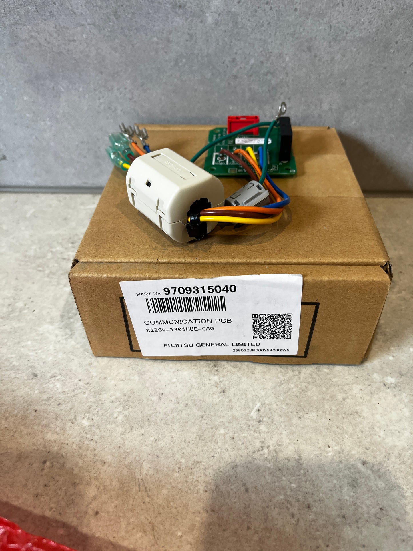 Fujitsu Communication PCB Kit with wiring and connectors on cardboard box