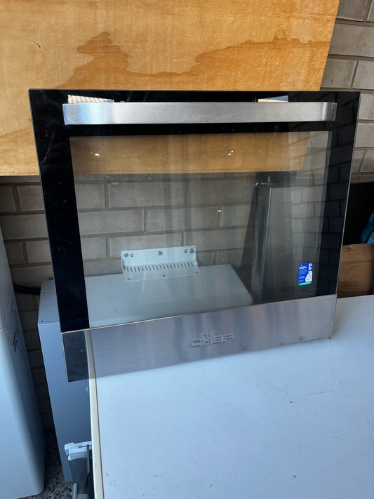 Chef oven door with stainless steel handle and clear glass window front view