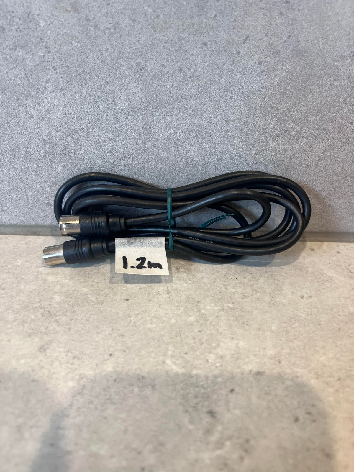 Coiled 1.2 meter black coaxial cable with metal connectors