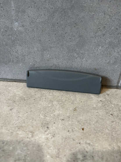 Front view of gray plastic replacement drawer handle