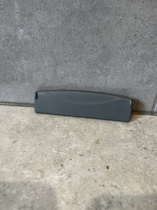 Front view of gray plastic replacement drawer handle