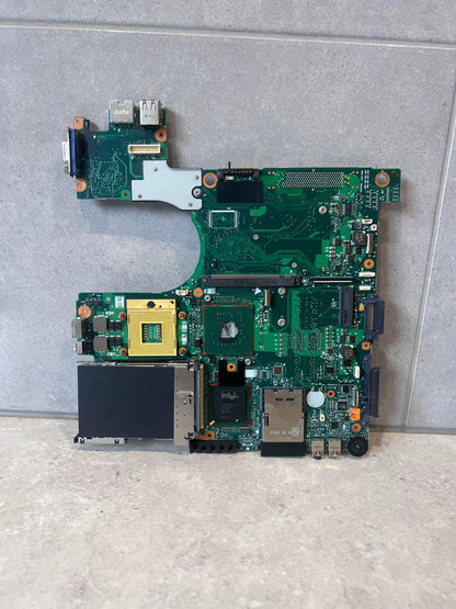 Front view of laptop motherboard with exposed ports and Intel chipset