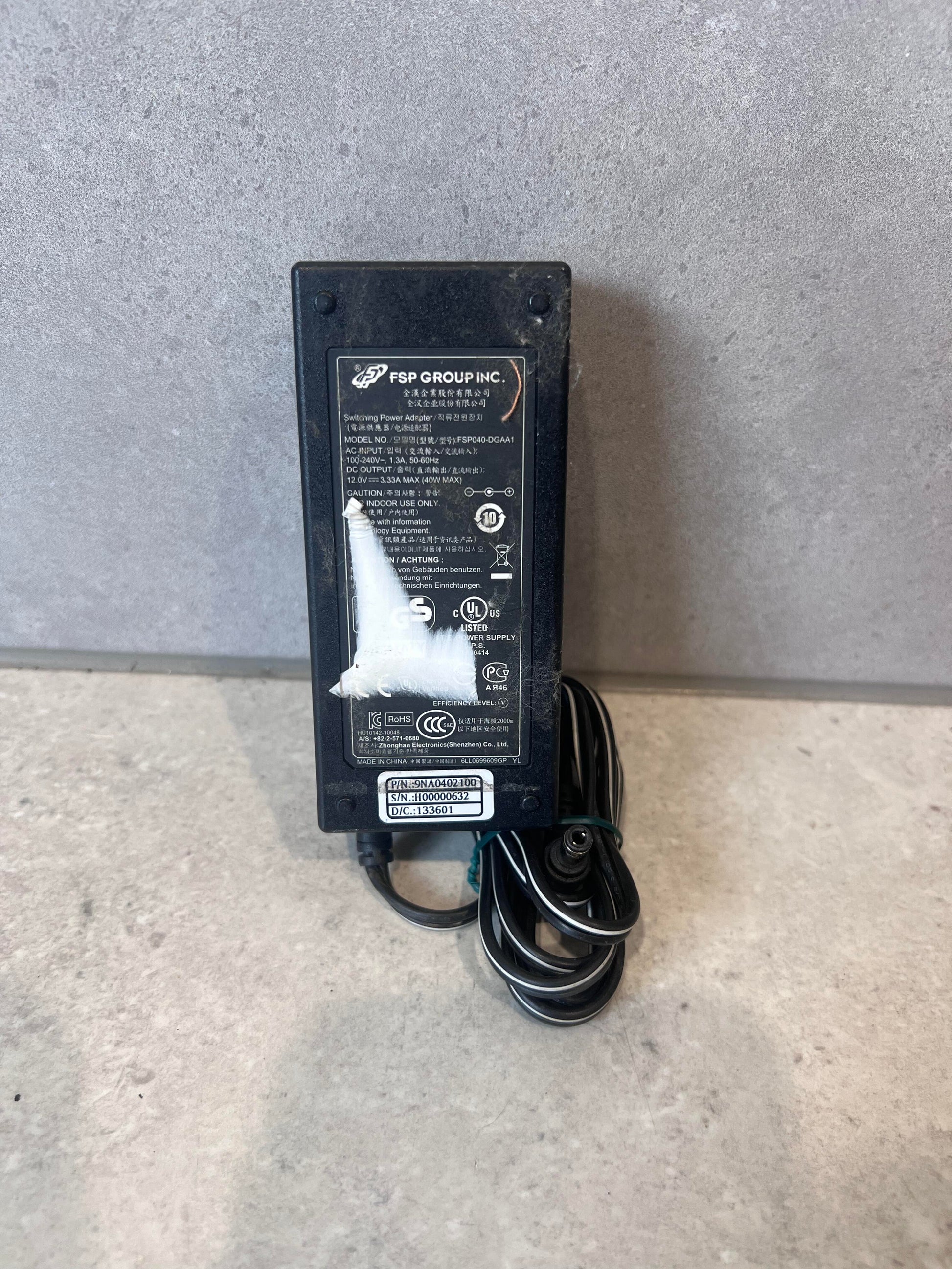 FSP Group 12V 3.33A black power adapter with cord on gray surface