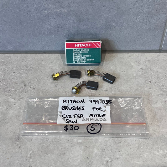 Hitachi 999-038 carbon brushes set with box for C12 FSA mitre saw, laid out on countertop
