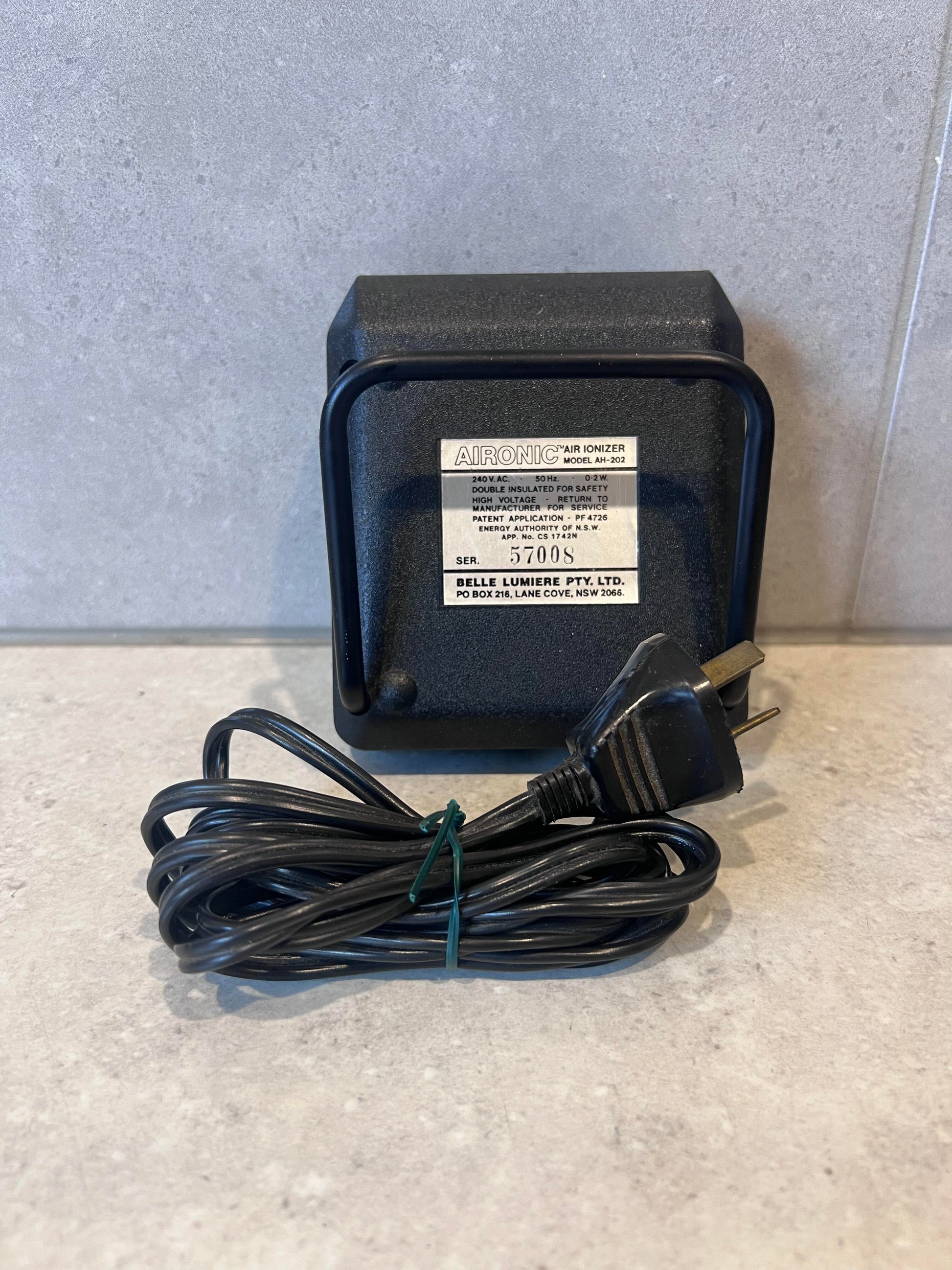 Aironic AM-202 Air Ionizer by Belle Lumiere with power cord on countertop