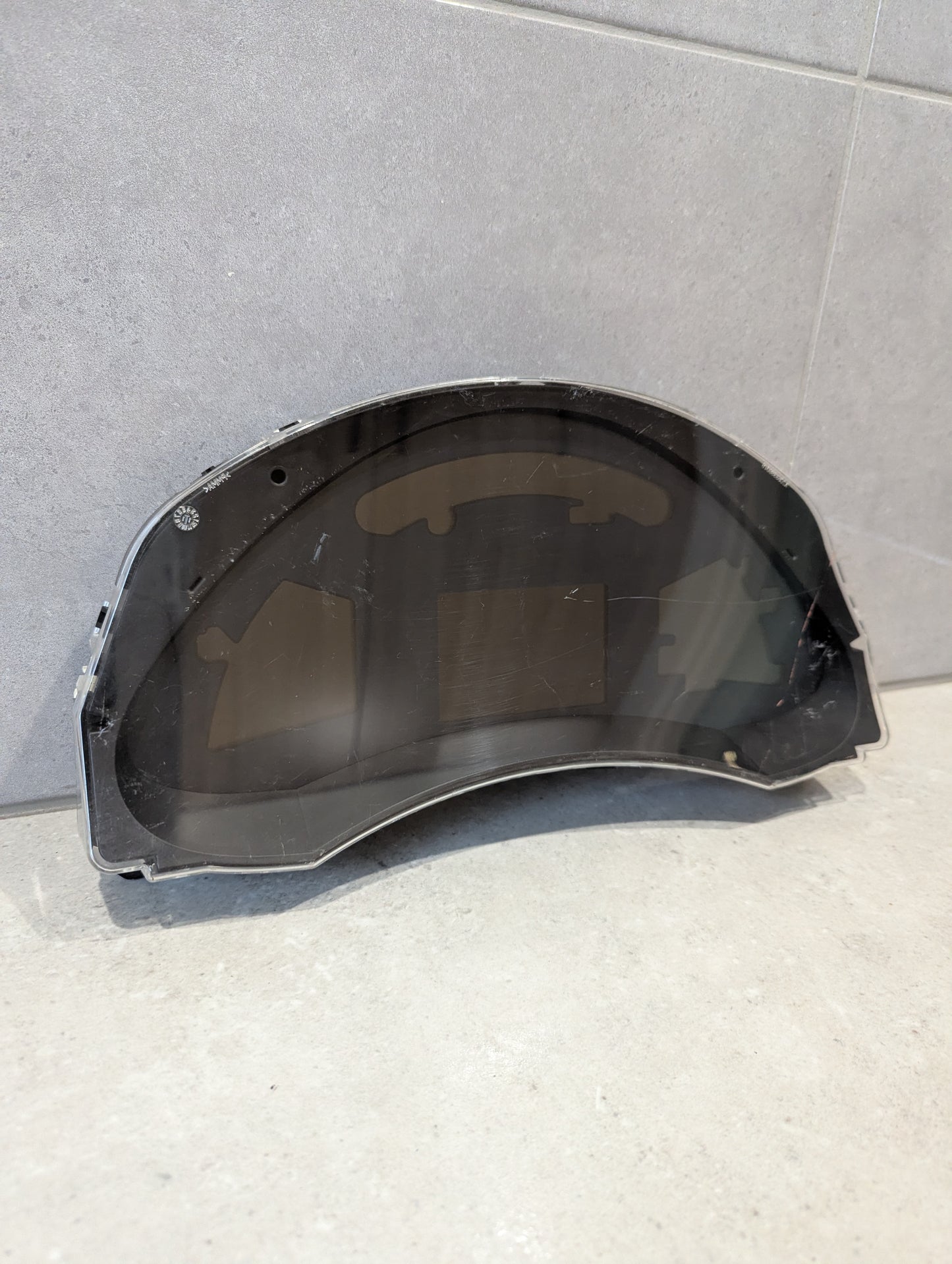 Front view of Nissan Leaf ZE0 odometer cluster assembly with clear lens