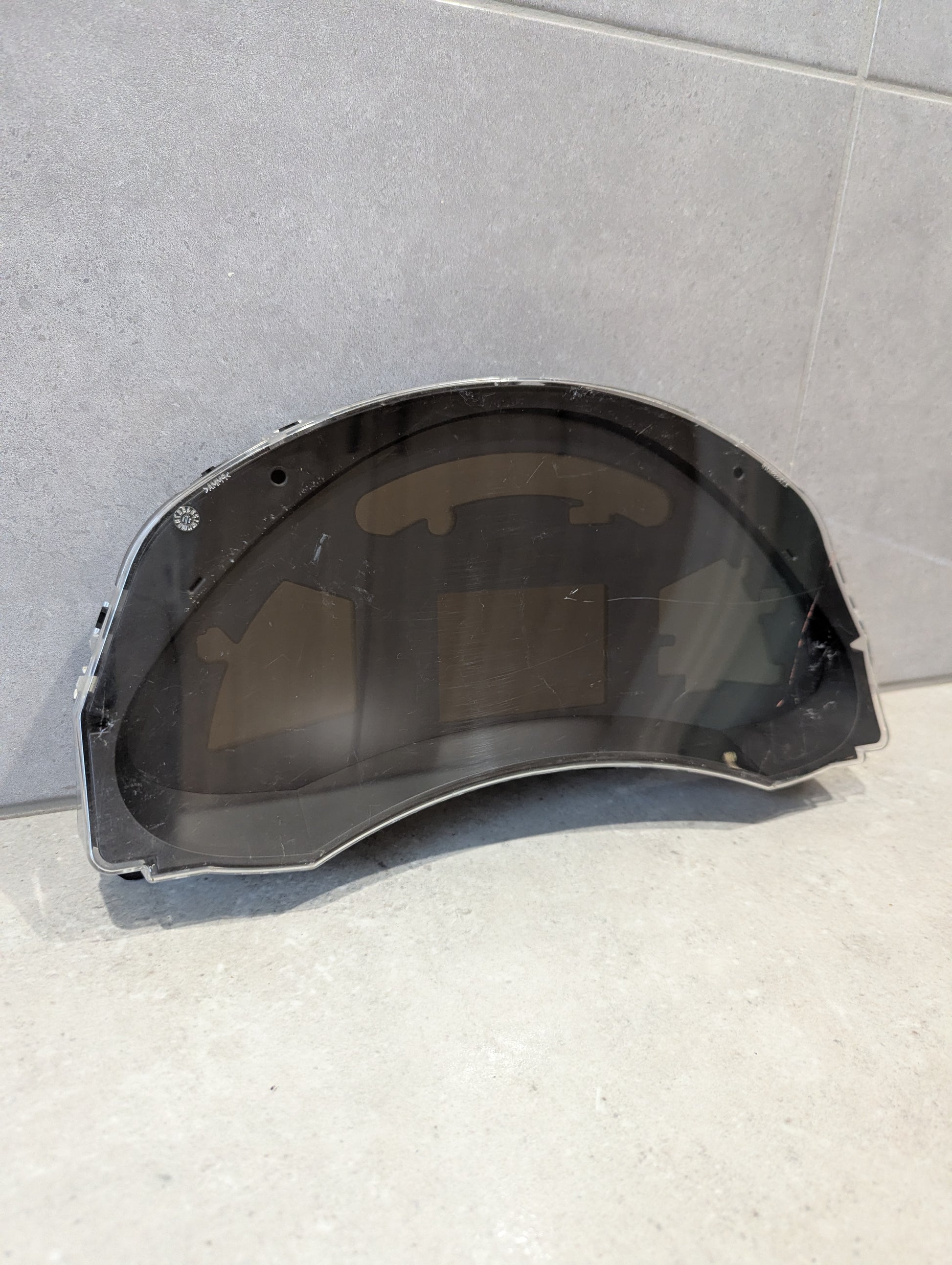 Front view of Nissan Leaf ZE0 odometer cluster assembly with clear lens