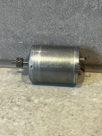 RK-370CA DC motor showing helical gear and metal housing close-up