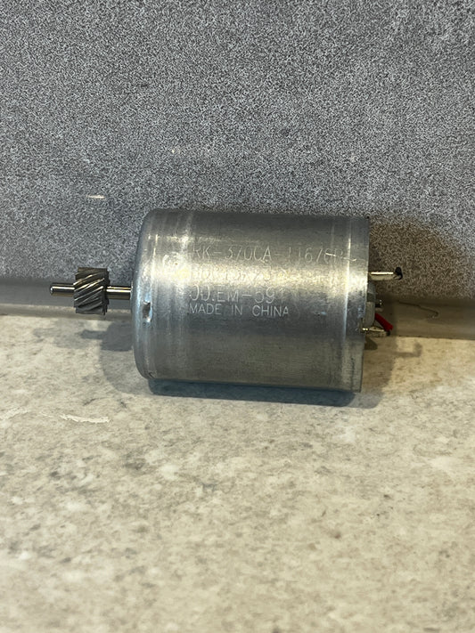RK-370CA DC motor showing helical gear and metal housing close-up