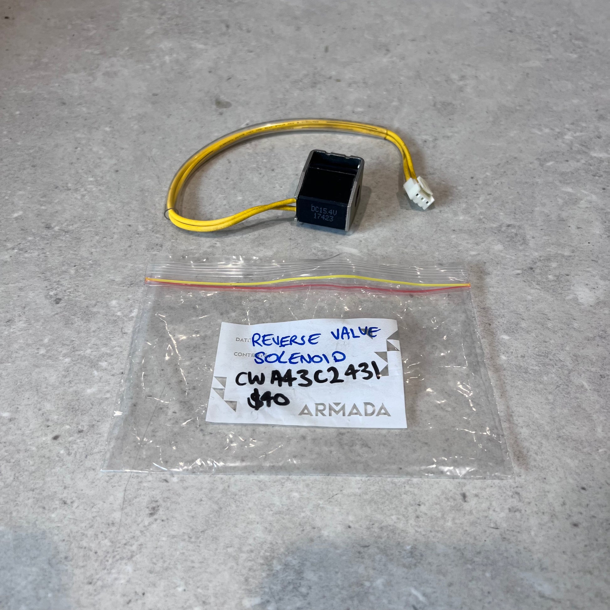 Reverse valve solenoid with yellow wire and clear ARMADA labeled plastic bag