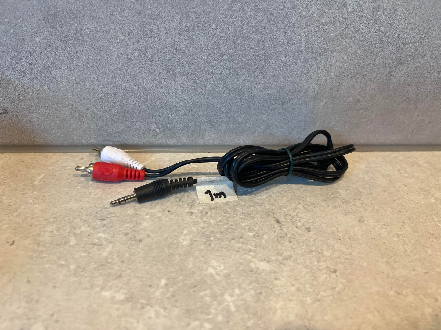 3.5mm male to RCA stereo audio cable adapter with black cable, red and white connectors, 1 meter length