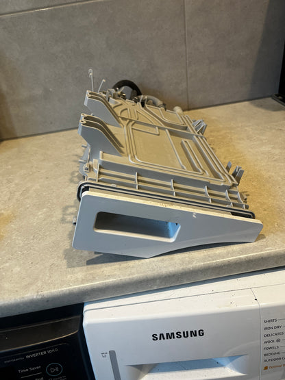 Samsung washing machine detergent drawer assembly on countertop