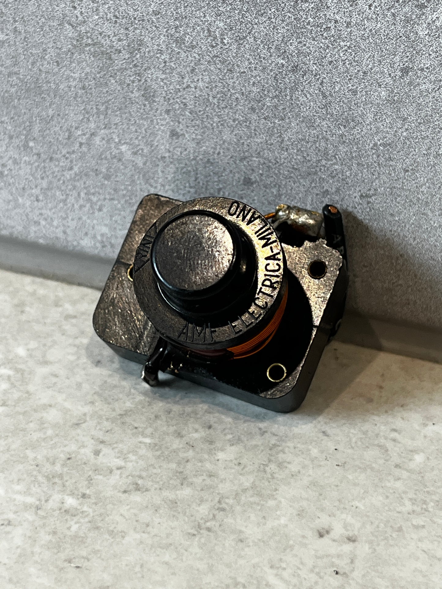Front angle of a durable momentary push button switch with copper coil
