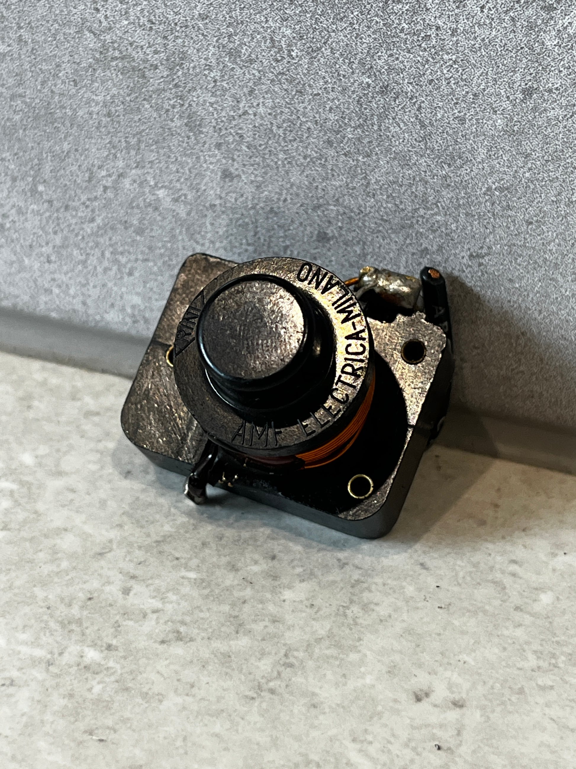 Front angle of a durable momentary push button switch with copper coil