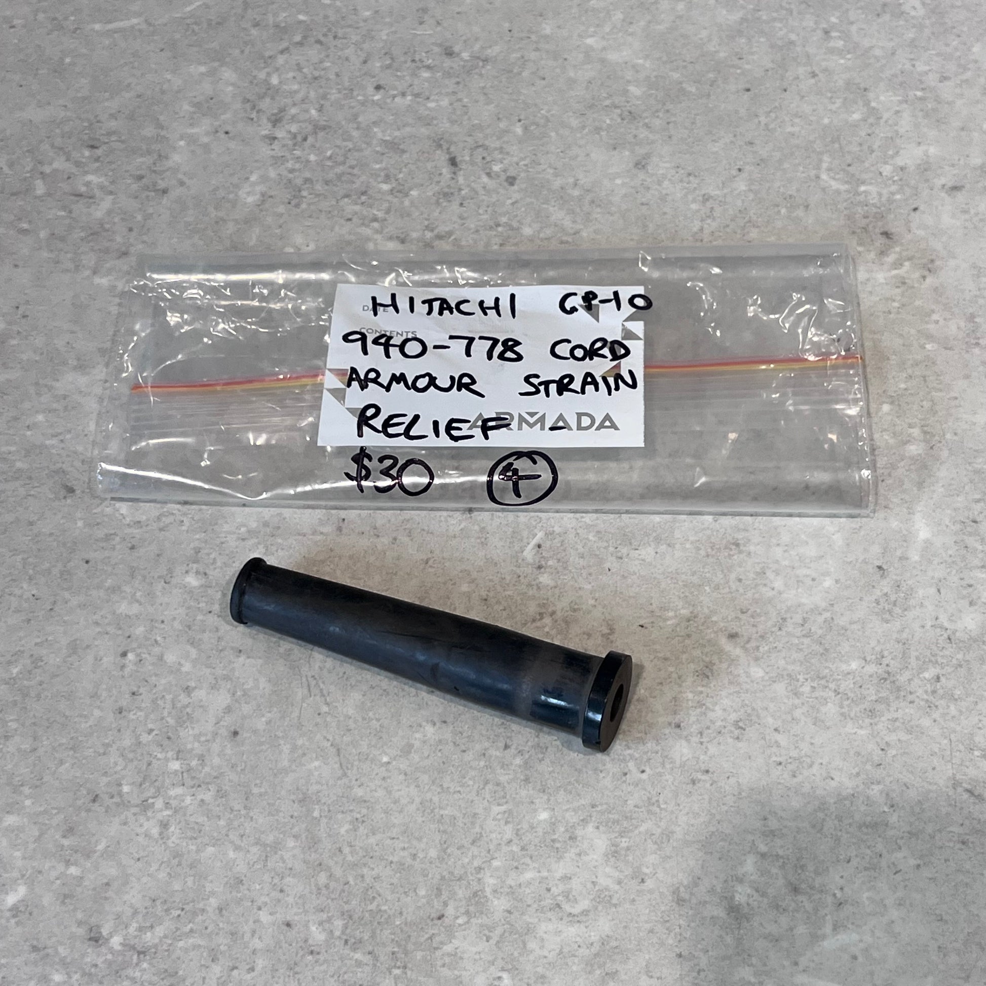 Hitachi 940-778 cord strain relief replacement part on gray surface