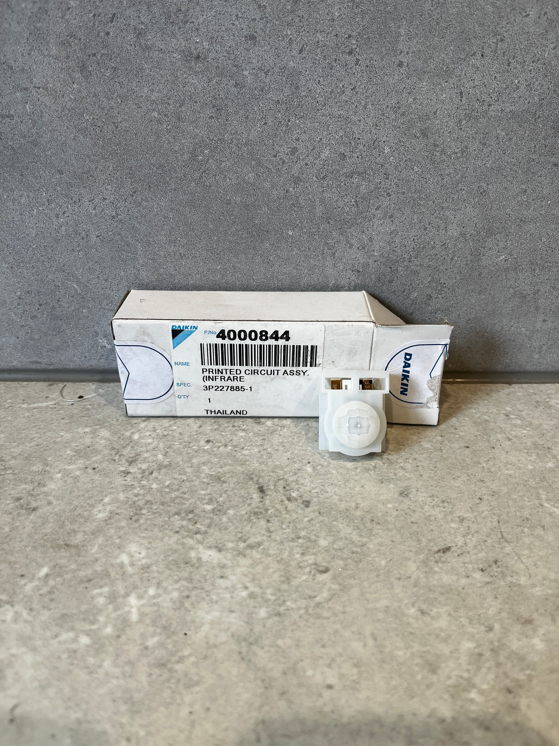 Daikin infrared circuit assembly with packaging on concrete surface