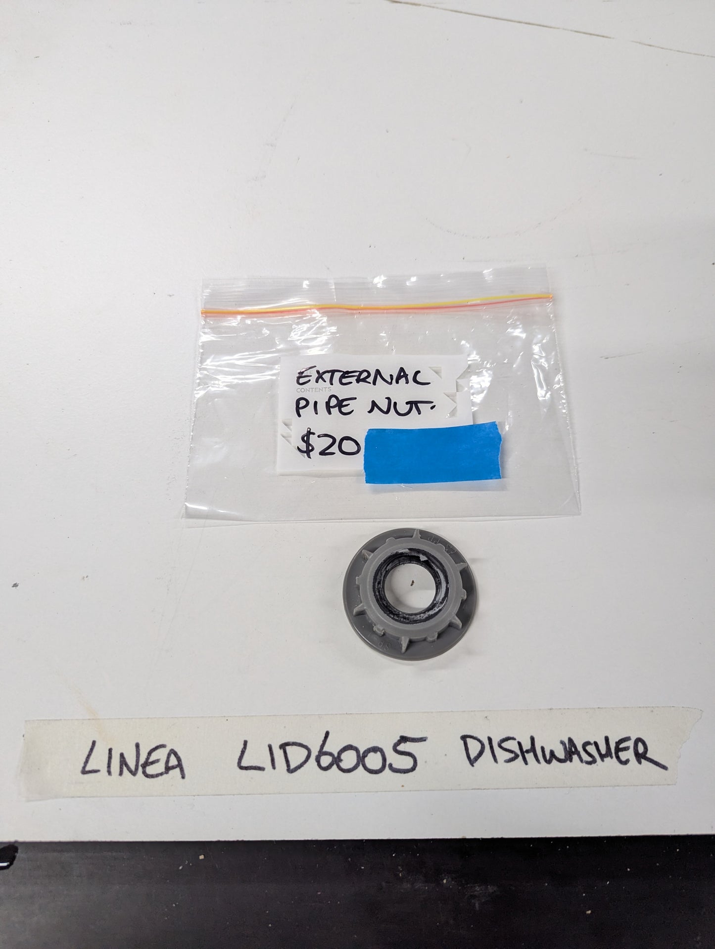 Linea LID6005 dishwasher external pipe nut and labeled storage bag