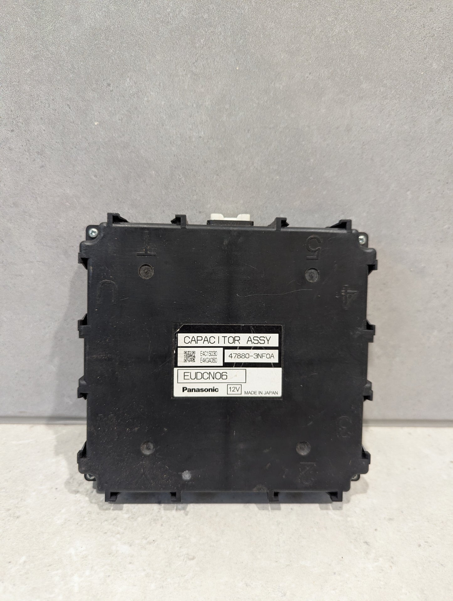 Front view of Panasonic EUDCN06 12V Capacitor Assembly with label visible
