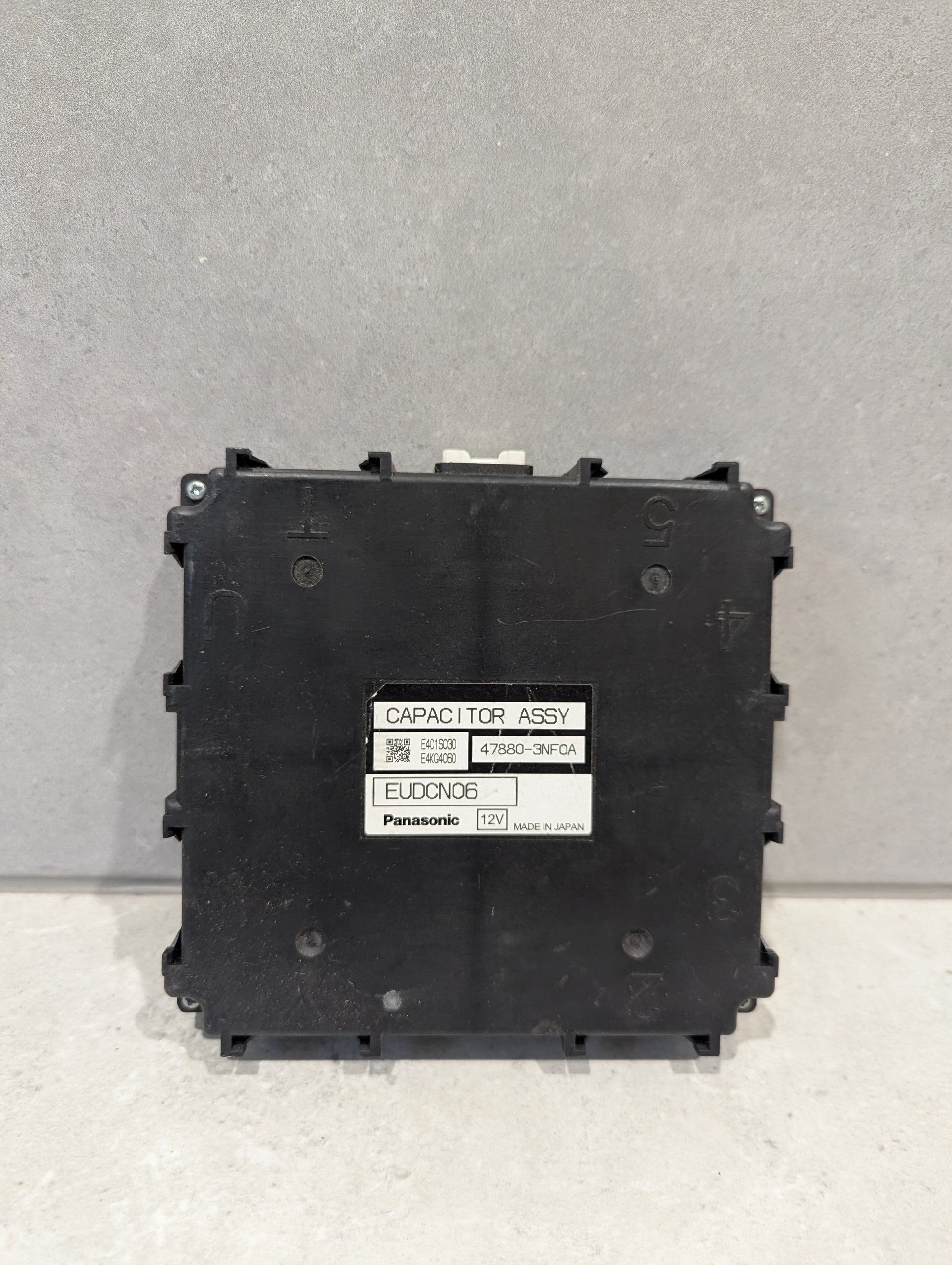 Front view of Panasonic EUDCN06 12V Capacitor Assembly with label visible