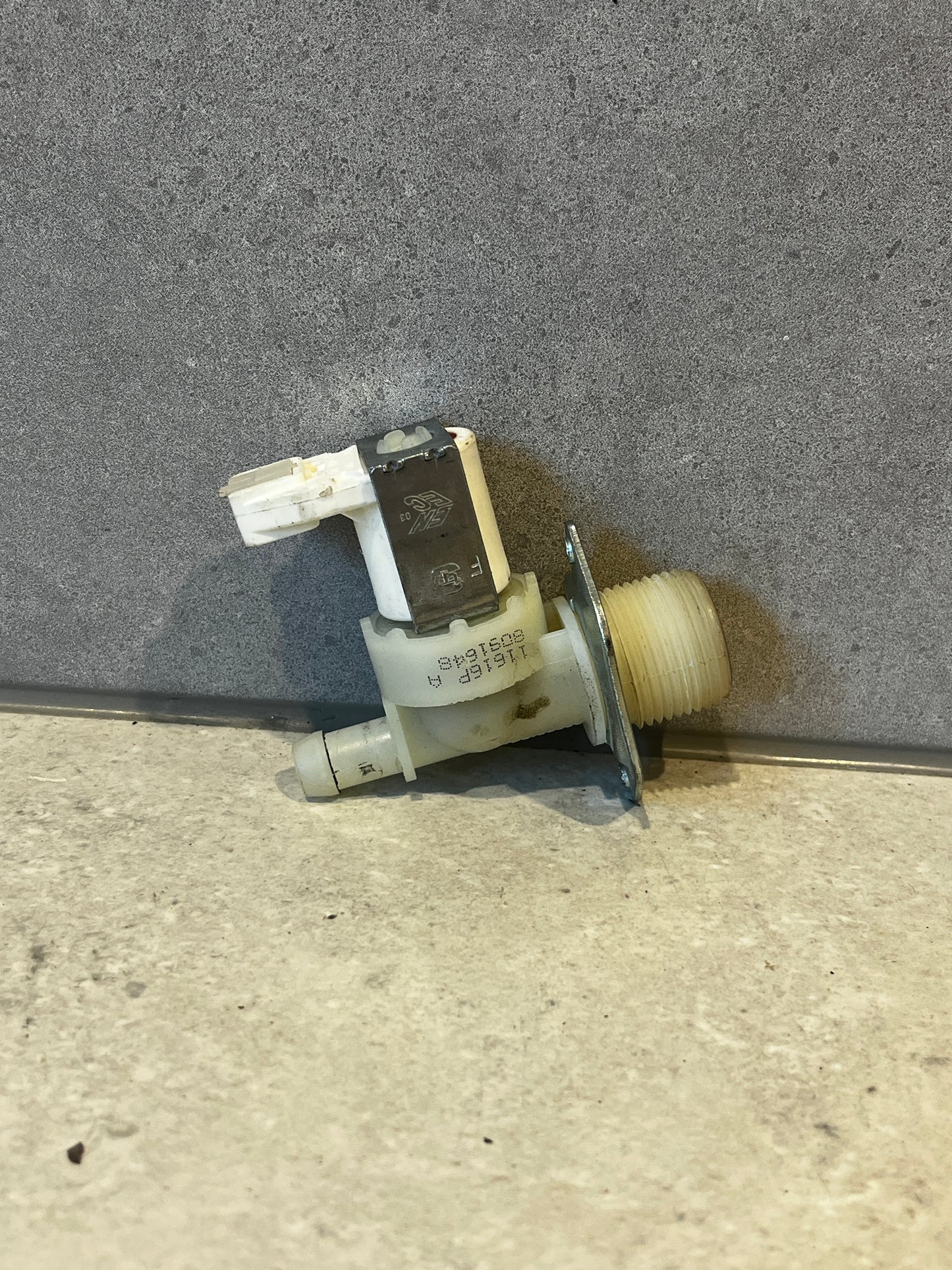 Universal washing machine water inlet valve showing side with threaded connection and mounting bracket