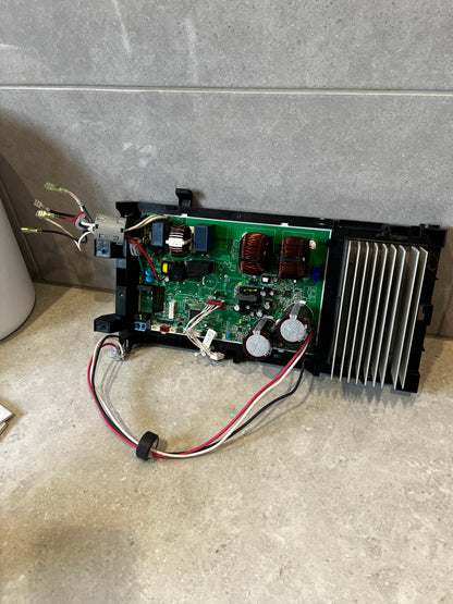 Electronic power control board with wiring and large heat sink on stone surface