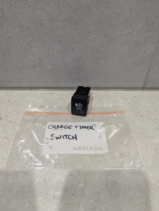 Armada black charge timer switch on a counter in a labeled plastic bag