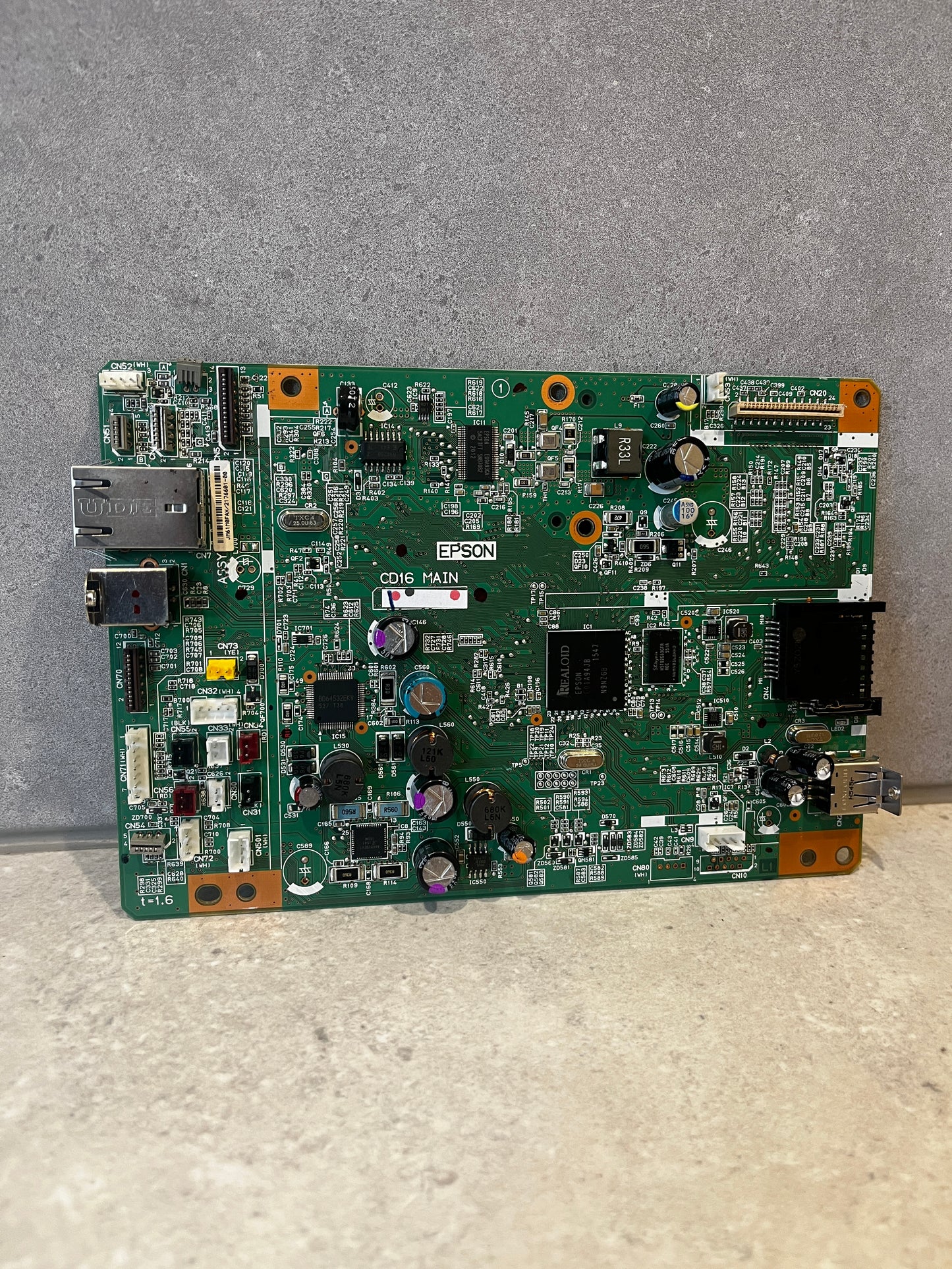 Front view of Epson circuit board with HDMI, USB ports and electronic components