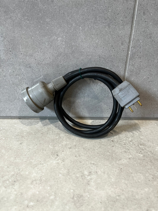 Indu Electric heavy-duty power cable coiled on a concrete surface