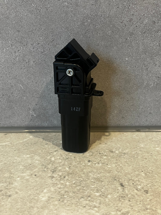 Black plastic automotive sensor with mounting brackets and integrated screw fastener
