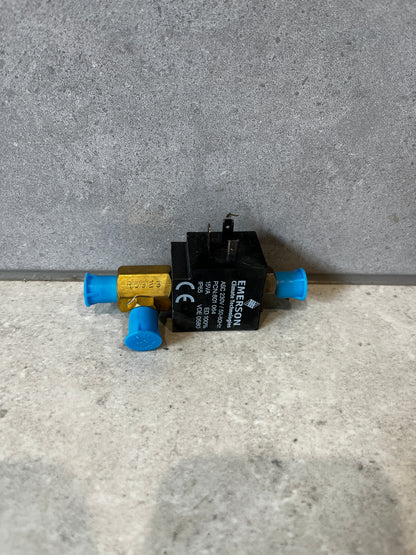 Front view of Emerson 702RA-001 refrigeration solenoid valve with blue caps