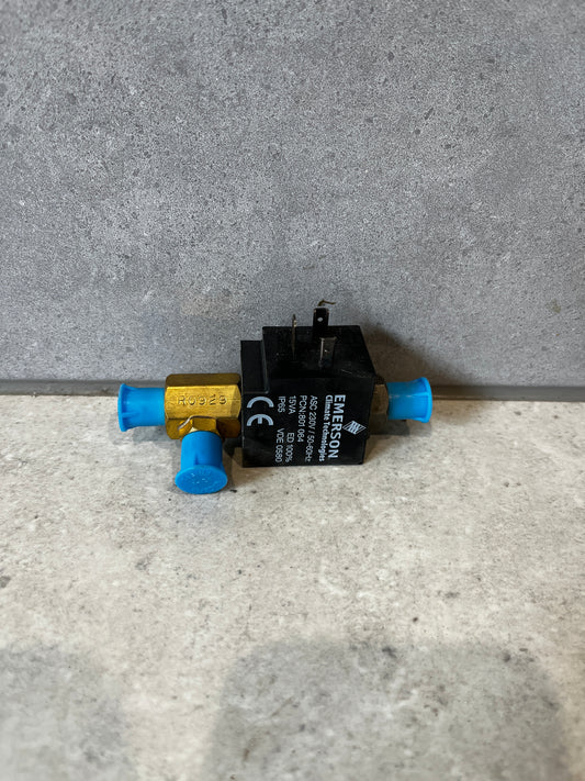 Front view of Emerson 702RA-001 refrigeration solenoid valve with blue caps