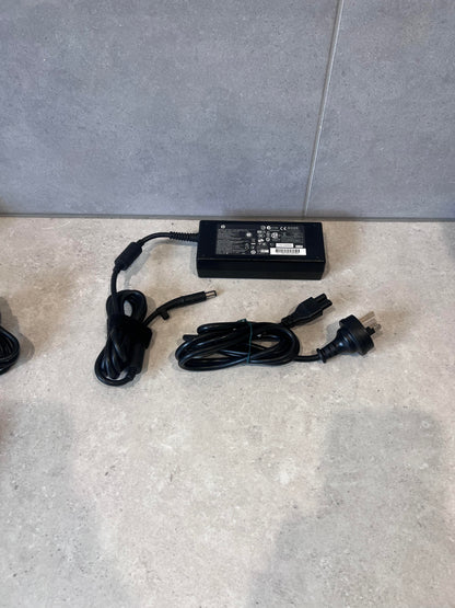 HP 120W laptop power adapter with AC cable and charging cord