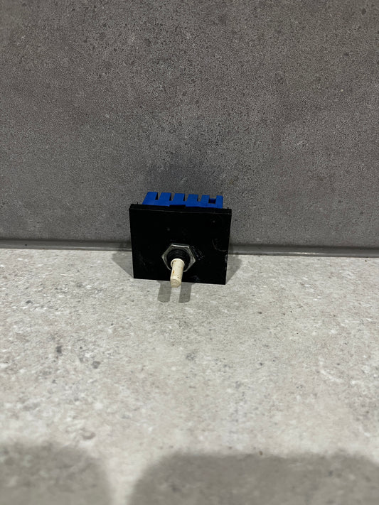 Electronic toggle switch module with black and blue housing and white lever