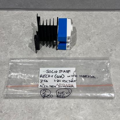 Solid state relay with heatsink and labeled bag on a gray surface