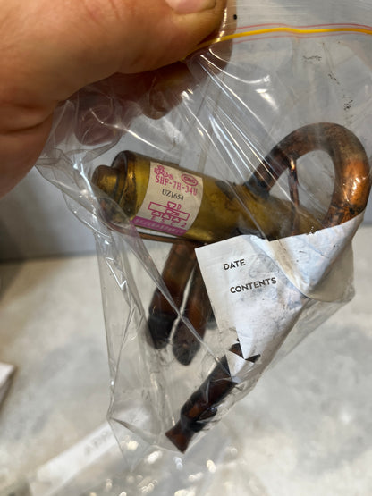 SHP-7H-34V brass and copper refrigerant expansion valve in plastic packaging