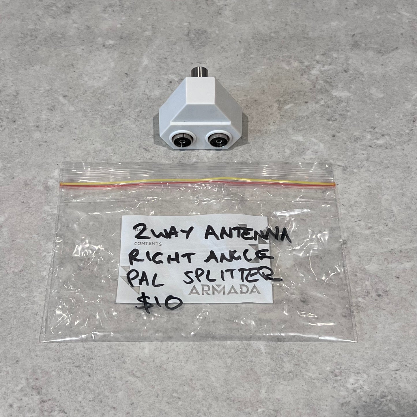 2-way right angle PAL antenna splitter on countertop with labeled bag