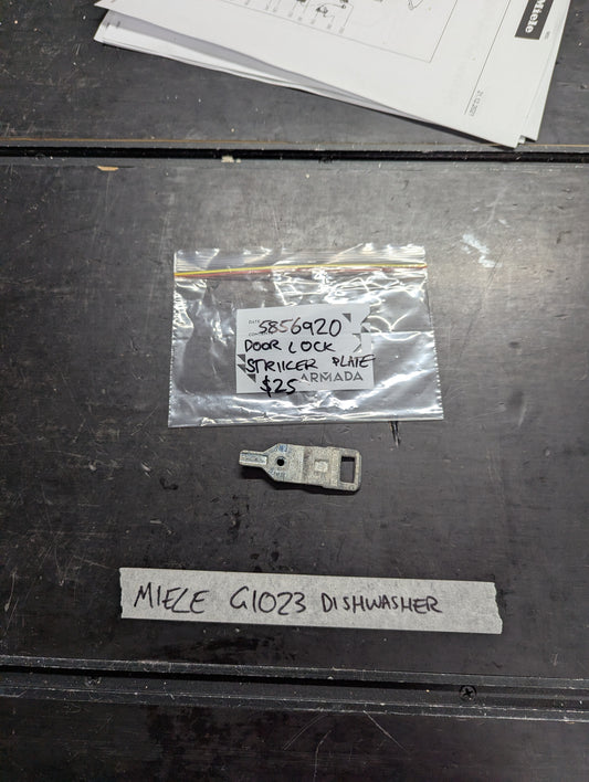 Miele G1023 dishwasher door lock striker plate with labeled packaging on a table