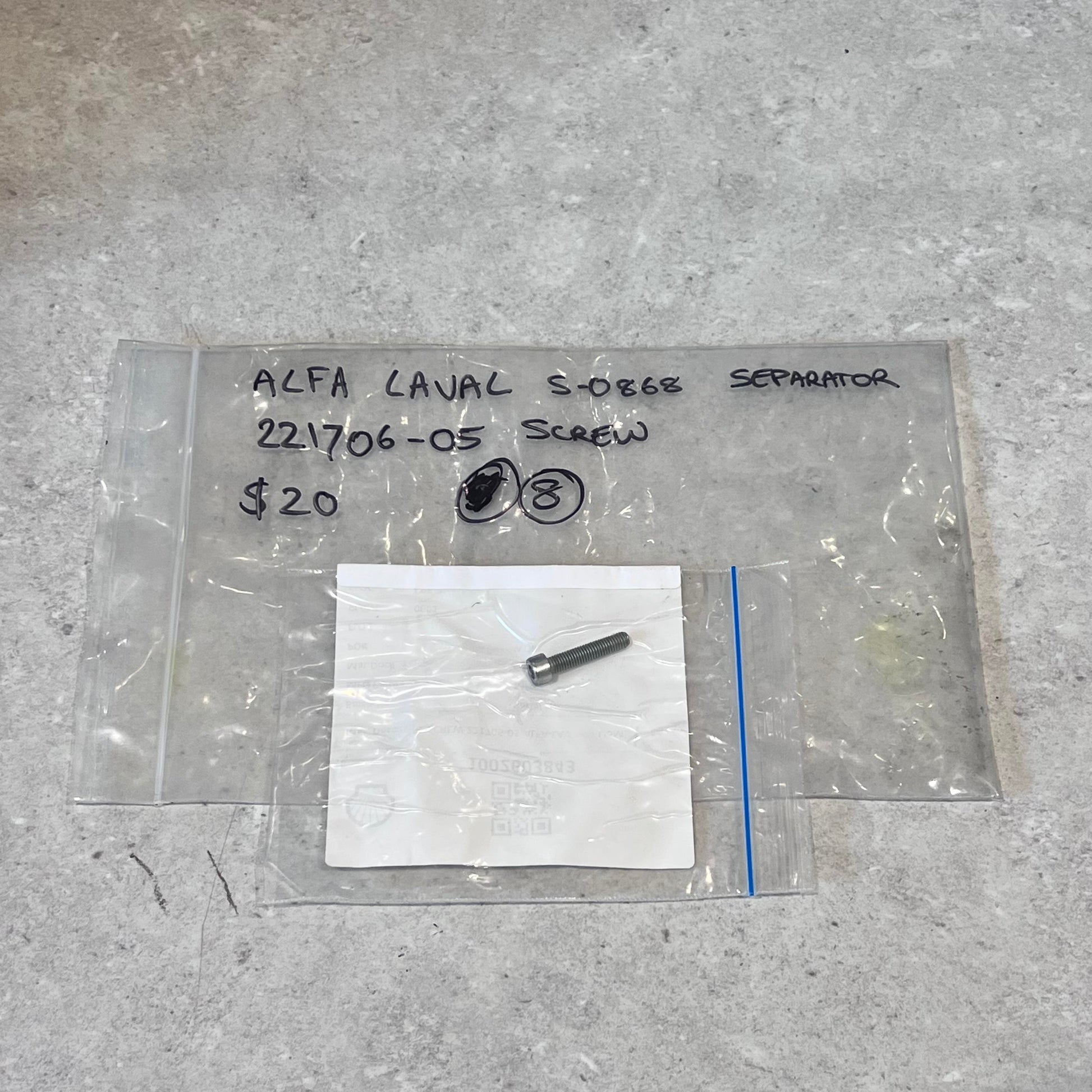 Alfa Laval S0868 Separator screw 221706-05 in clear packaging on a gray surface