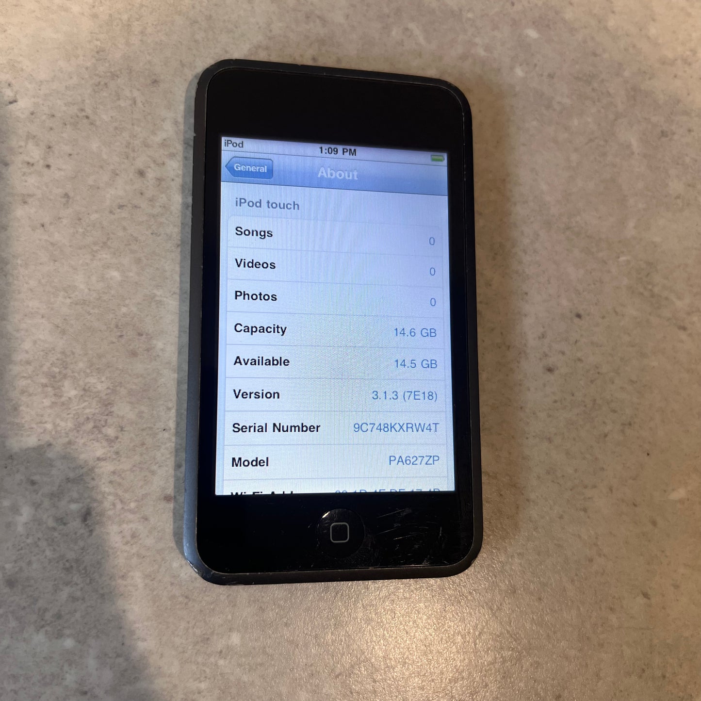 Front display of Apple iPod Touch showing device information and storage capacity