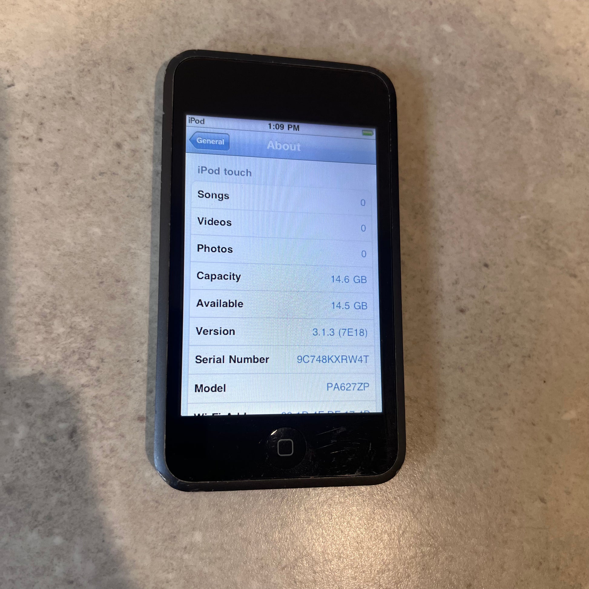 Front display of Apple iPod Touch showing device information and storage capacity