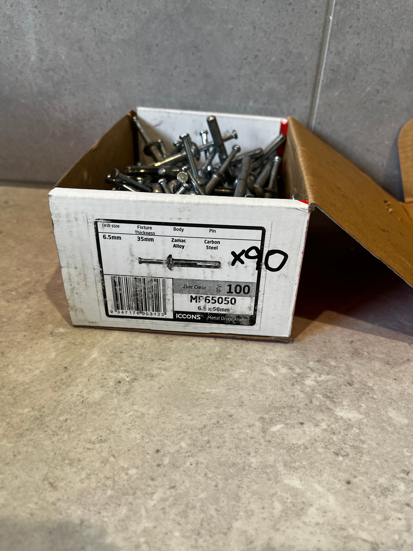 Box with ICCONS metal drive anchors and label showing specifications