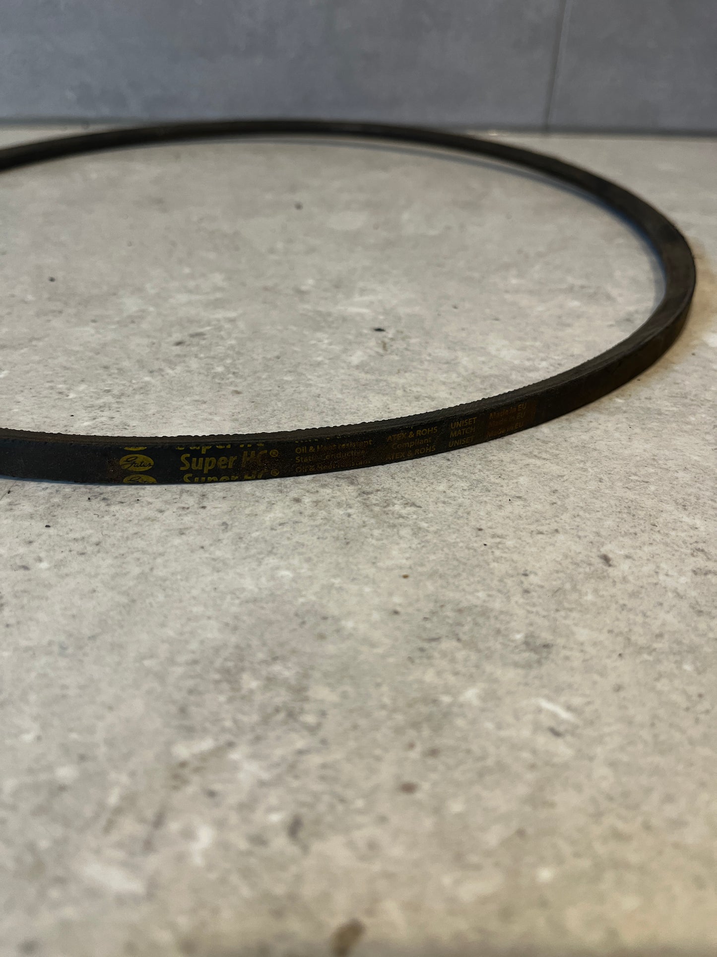Close-up of SPZ 1120 V-belt showing printed specifications
