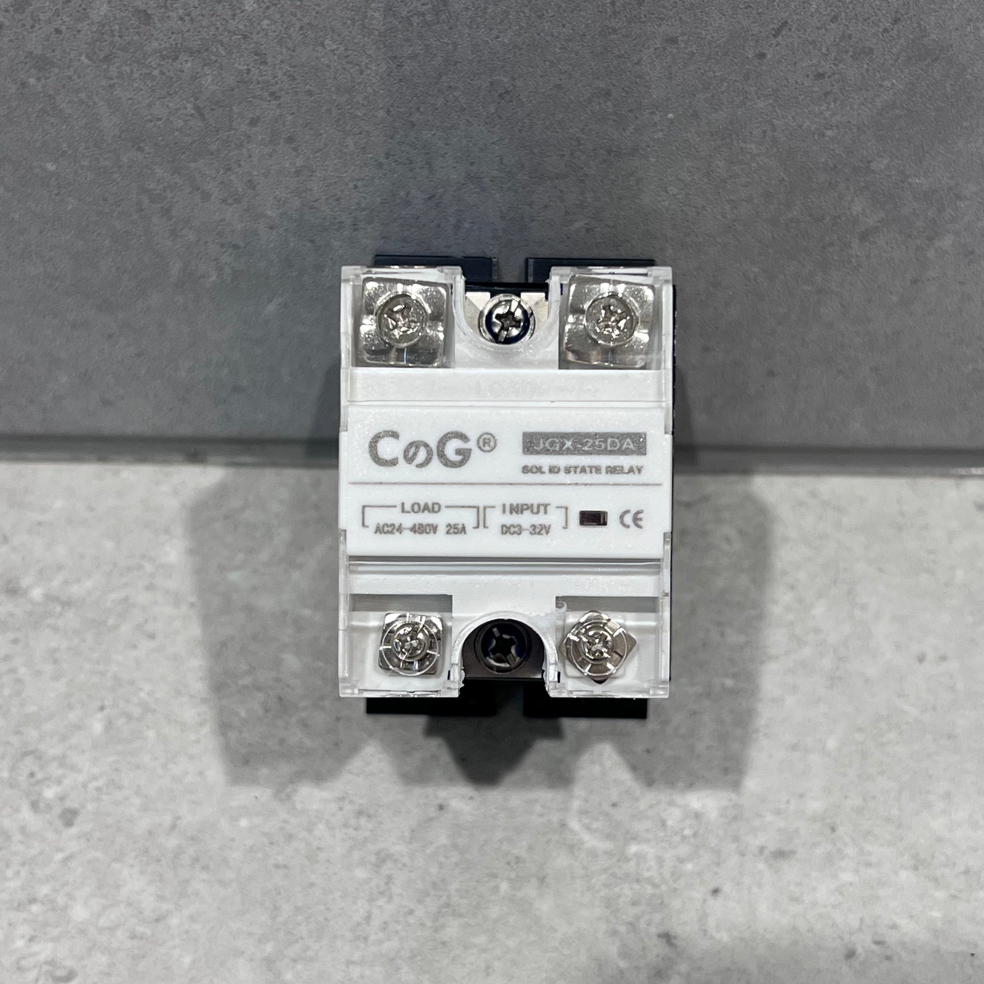CoG JQX-25DA solid state relay close-up showing terminals and specifications