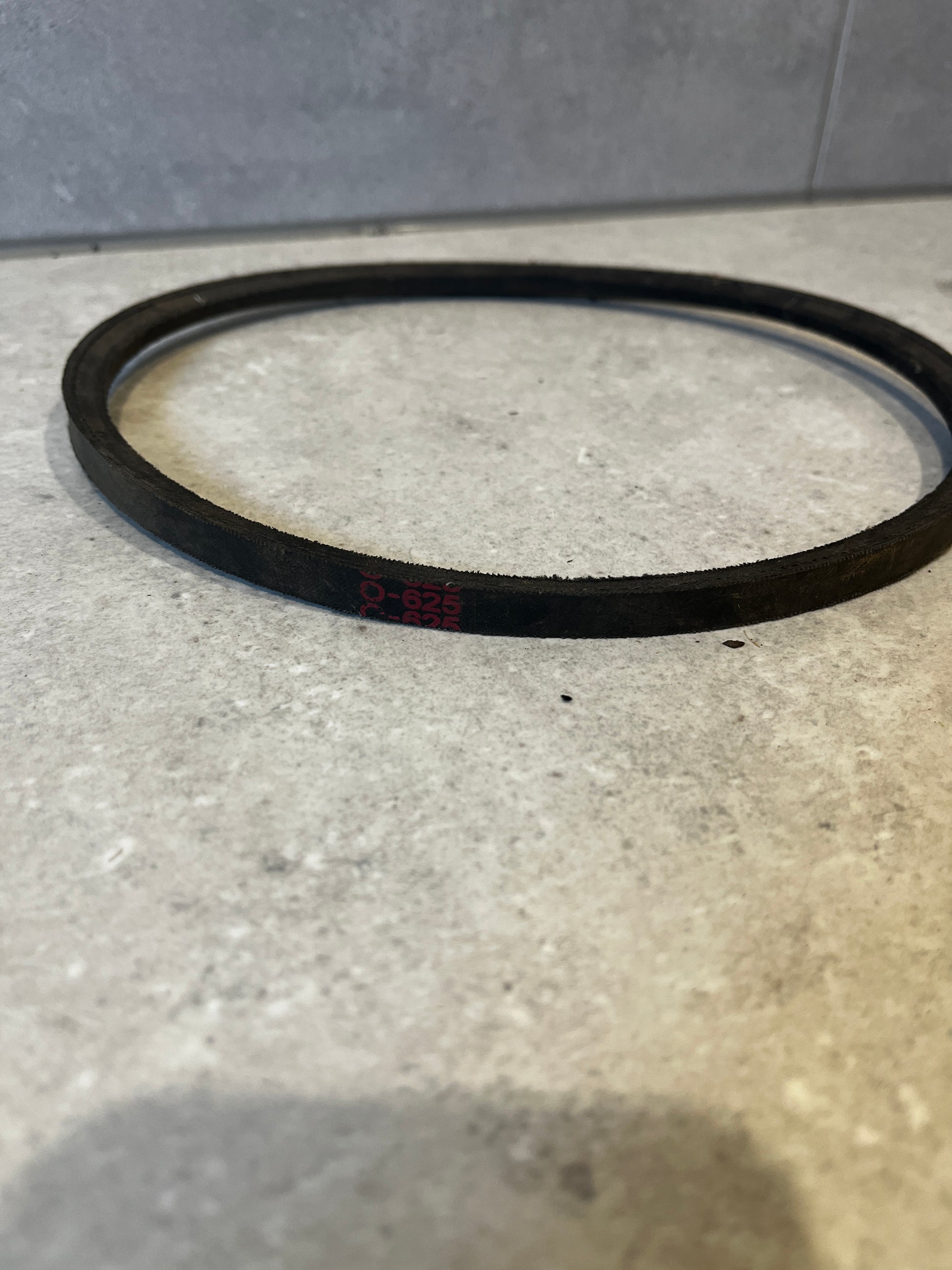 Side view of industrial rubber drive belt showing size marking